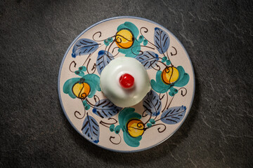 Traditional Sicilian cassata, sweet dessert cake with ricotta and candied fruits on typical ceramic...