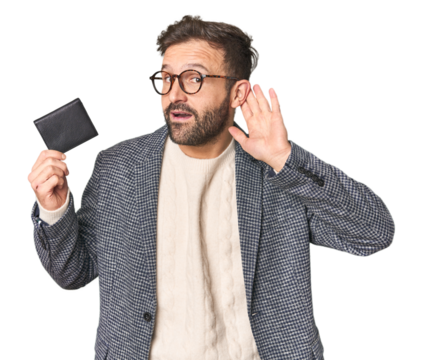Hispanic male with briefcase in studio trying to listening a gossip.