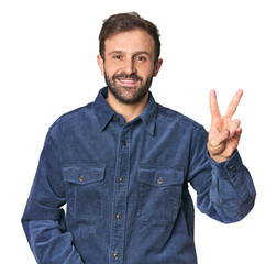 Fototapeta premium Studio portrait of young Hispanic male showing number two with fingers.