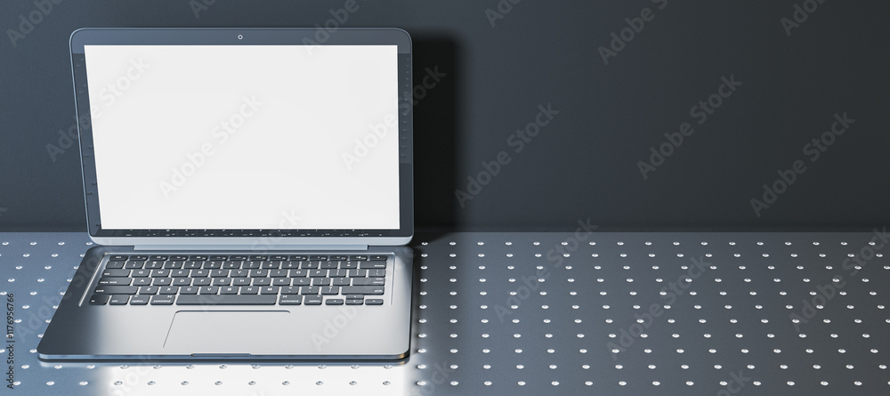 Poster open laptop with blank white screen on dotted metallic surface and dark background. modern and clean