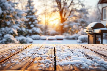 Snow-covered wooden table with a blurred snowy backyard and morning sunshine in the background.