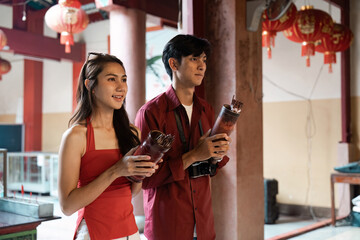 Celebrating tradition young adults participating in cultural festival temple event indoor upbeat vibe