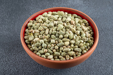 A bowlful of natural dried thyme seeds close-up