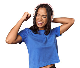 Joyful Filipino woman dancing with headphones