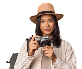 Traveling Filipino young woman with vintage camera