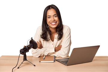 Filipino woman podcasting with mic and laptop