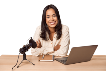 Filipino woman podcasting with mic and laptop