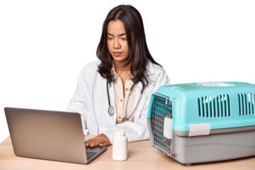 Young Filipino vet with laptop and carrier, caring