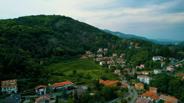 4K Aerial Drone Video of Mountainside Farmhouses and Vineyards in Cavallasca, Italy on a Summer Evening