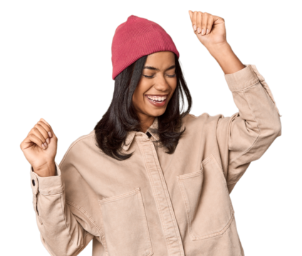 Joyful Filipino woman dancing in studio