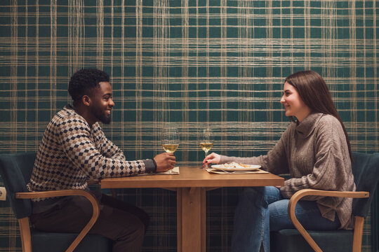 Young couple having romantic dinner on their first date.