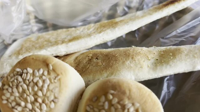 Close-up of pieces of white bread with white sesame.