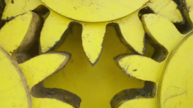 CLOSE UP SHOT OF OLD GEAR SPINNING AT A FACTORY