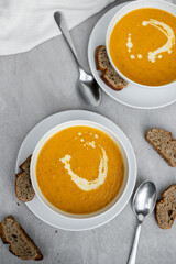 Creamy Lentils Soup with Bread Slices on a Rustic Table