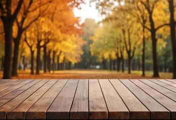 A wooden table with a blurry autumn background