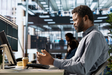 African american CEO discussing about monthly revenue with shareholders, attending a videoconference call remote meeting. Young entrepreneur asking for more funds, online communication.