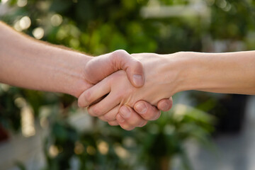 Close up picture of two hands in a handshake