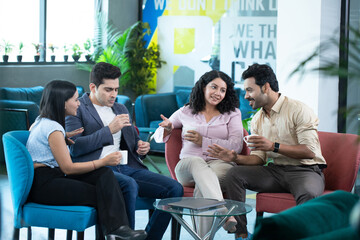 Happy Workers With Tea Cups During Break