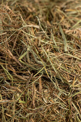 a pile of green straw for long-term storage