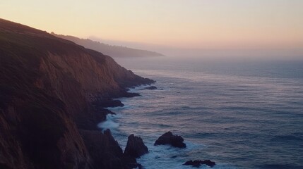 Obraz premium Serene Sunset over Coastal Cliffs and Ocean