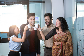 Office Friends Cheering Coffee While Standing