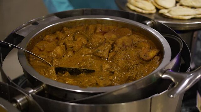 Alu dum cooked with Indian spices