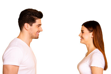 Close up side profile photo funny amazing beautiful she her he him his guy lady laugh laughter stand opposite wait first who take eyes off wear casual white t-shirts outfit isolated yellow background