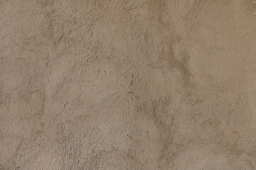 Rough textures of adobe walls reveal the beauty of traditional craftsmanship in a sunlit desert...