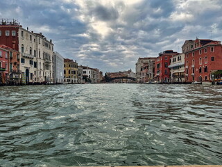Scenic View of the Grand Canal in Venice, Italy, Showcasing Historic Buildings and Cloudy Skies in 2024