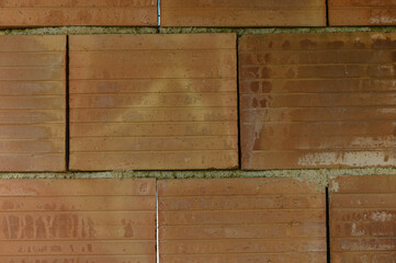 Construction project showcasing freshly laid red bricks under natural light