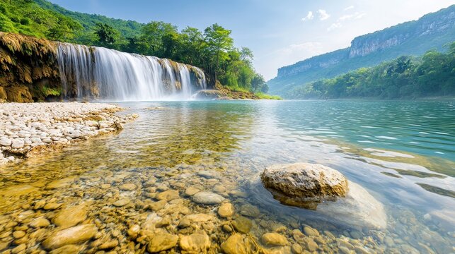 The Mun daeng Waterfall is a mesmerizing cascade of crystal clear water, surrounded by lush green forests and the sounds of nature echoing through the air