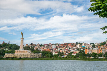 Photo of Antananarivo city with the emblematic angel's statue in the middle of Anosy lake
