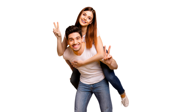 Portrait of his he her she two nice attractive cheerful cheery optimistic people having fun vacation holiday showing v-sign isolated over vivid shine bright yellow background
