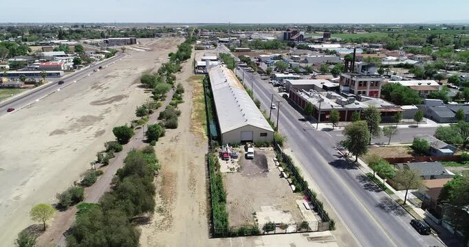 Drone footage of a warehouse near downtown los banos in california