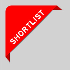 Red color of corner label banner with word shortlist on gray background