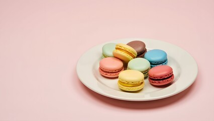 Obraz premium A plate of colorful macarons arranged neatly on a pastel pink background, creating a minimalist and elegant dessert presentation perfect for parties, celebrations, or sweet indulgence.