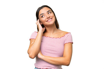 Young caucasian woman isolated on green chroma background thinking an idea