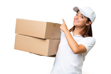Delivery caucasian woman holding boxes isolated on green chroma background pointing back