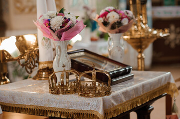 Elegant Wedding Altar Decor with Floral Arrangements and Crowns