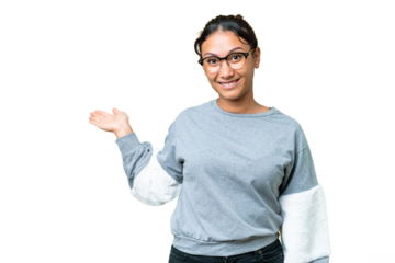 Young Uruguayan woman over isolated chroma key background extending hands to the side for inviting to come