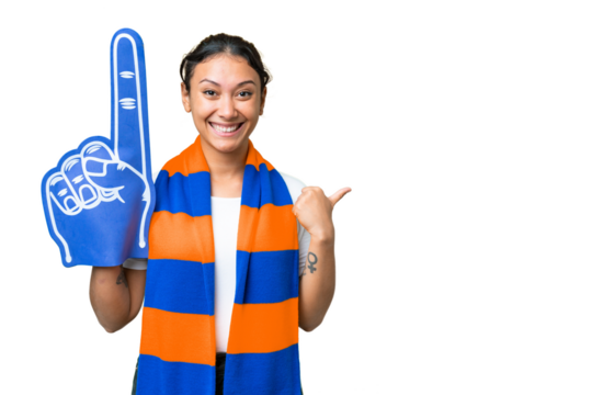 sports fan woman over isolated chroma key background pointing to the side to present a product