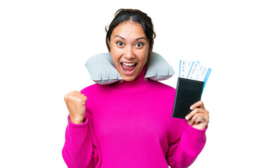 Young Uruguayan woman holding a passport over isolated chroma key background celebrating a victory...