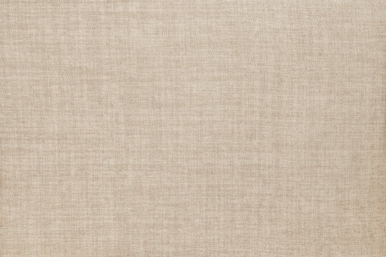 Brown linen fabric cloth texture for background, natural textile pattern.
