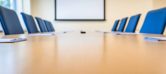 Modern boardroom with a long wooden table stylish leather chairs and a sleek projector screen ready for meetings