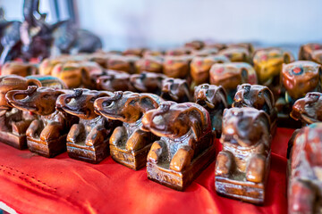 The small elephant clay figurines at the counter in Donsao Market, Laos