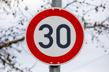 German 30km/h Speed Limit Traffic Sign on Pole &ndash; European Road Safety and Transportation