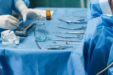 Sterile surgical instruments of an otolaryngologist on the operating table