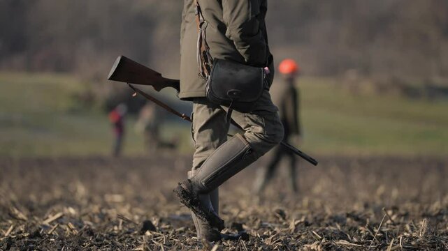 Hunters are hunting game in winter.