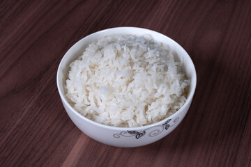 Long white rice in a white porcelain bowl