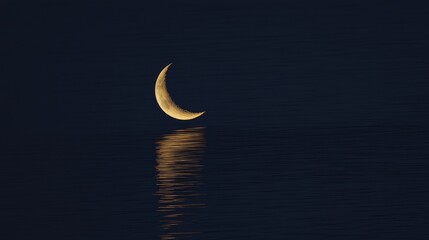 Crescent Moon's Serene Reflection on Dark Waters